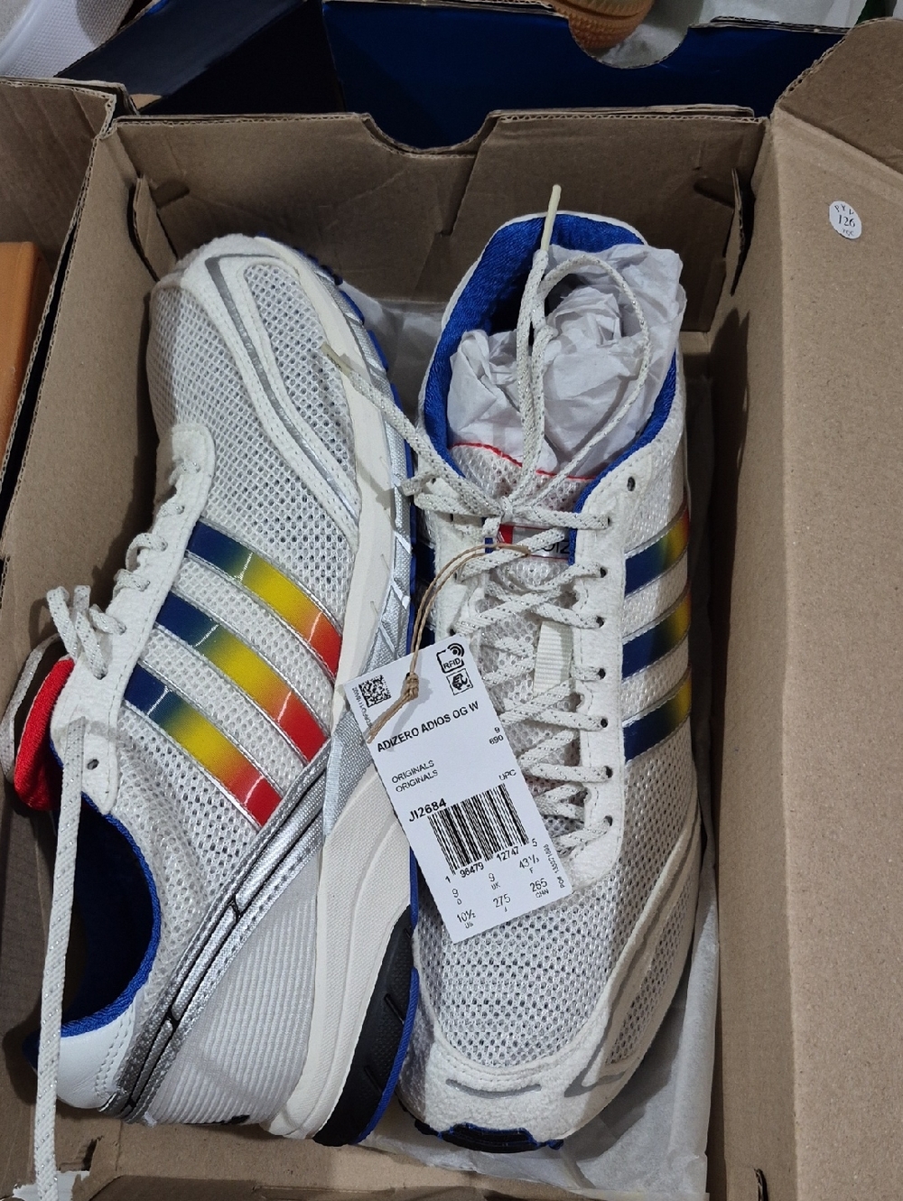 adidas White Mesh Sneakers with Rainbow Stripe Accents
